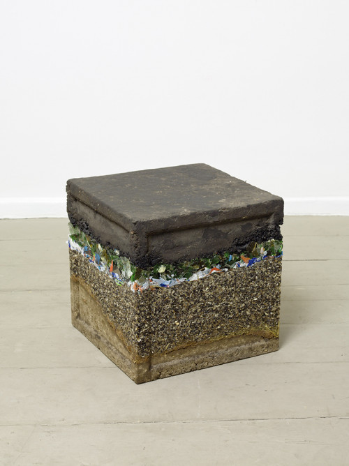 
     <i>learning cube (soil sample)</i>, 
     2011<br />
     pebbles, sand, Styrofoam, wood chips, Paper, plastic and glass trash, dirt, epoxy, 
      42 × 42 × 42 cm<br />
     