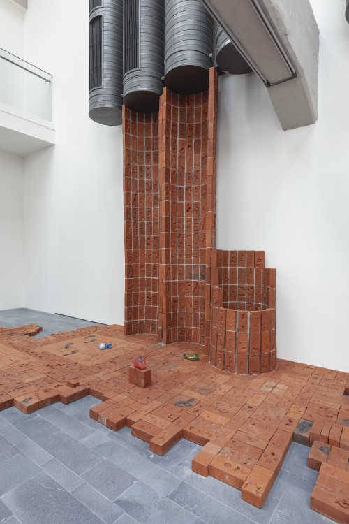 
     <i>Body Bricks</i>, 
     2019<br />
     2455 individually imprinted clay bricks (replica of original brick from the historical shipyards, Golden Horn), in cooperation with Işıklar Tuğla, Bartın, 
     <br />
     Installation view 16th Istanbul Biennial, Turkey, 2019