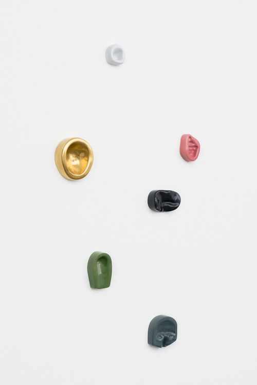 
     <i>Leaning Wall (6)</i>, 
     2013/2014<br />
     Imprints of female and male body parts cast in colour-glazed Meissen porcelain, 
      various sizes<br />
     