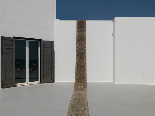 
     <i>Läufer [Rug] (serial)</i>, 
     2014<br />
     Carpet, 
      67 x 2000 cm<br />
     Installation view Art Space Pythagorion, Pythagóreio, Samos, Greece, 2014 (Photo by Stathis Mamalakis)