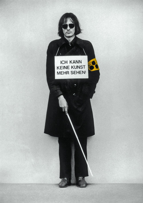 
     <i>Ich kann keine Kunst mehr sehen!</i>, 
     1975<br />
      
     <br />
     Demonstration as ‘sandwich-man’ with blindman’s stick and courtesy armband for the visually impaired at ‘Internationaler Kunstmarkt Köln, 1975.
