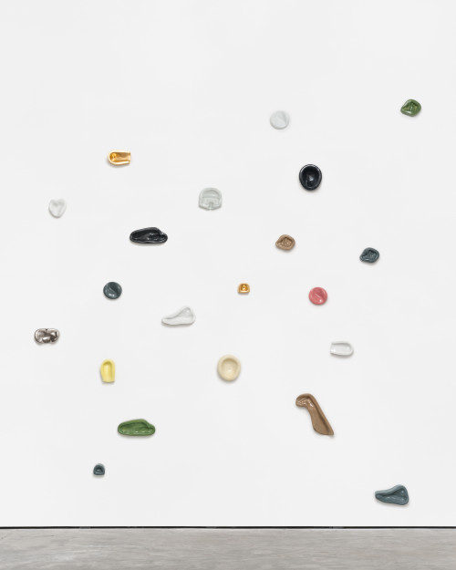 
     <i>Leaning Wall (21)</i>, 
     2013/2017<br />
     Imprints of female and male body parts cast in colour-glazed Meissen porcelain, 
      various sizes<br />
     The work consists of imprints of female and male body parts cast in ceramic. The pieces spread along the wall of the gallery like a climbing wall, inviting viewers to lean on, to see how their own body fits into this assemblage, which may well represent the average of society. Each viewer will surely find shapes that match and others that are completely at odds with his own body. They oscillate between the individual and the universal, they show a pattern – and the freedom to break away from it.