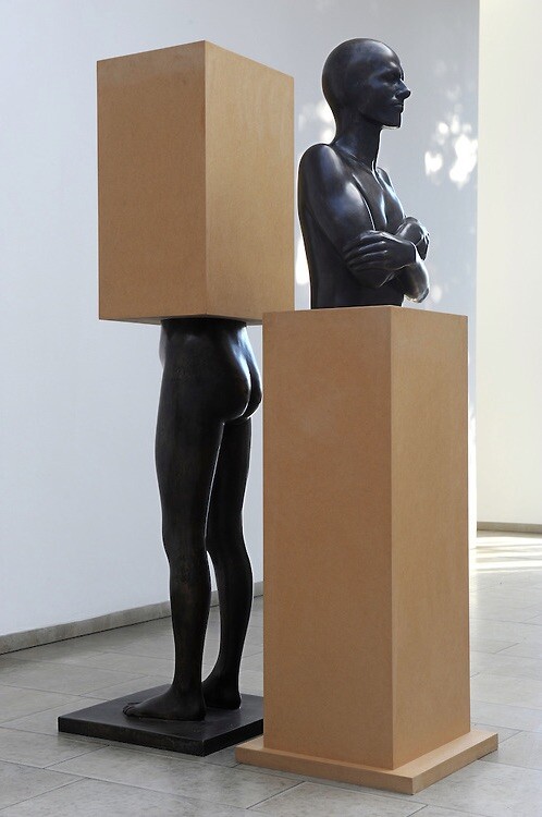 
     <i>Im Sockel - vom Sockel</i>, 
     1981/90<br />
     Bronze cast of the artists body with two MDF plinth, 
      185 x 50 x 50 cm (each)<br />
     