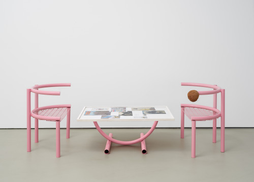 <i>Sitzmöbel (seating furniture / pink ensemble)</i>, 2020<br />powder coated metal, print and sketches on paper, glas, framed, table 39 x 163 x 73 cm / each chair 69 x 40 x 80 cm<br />